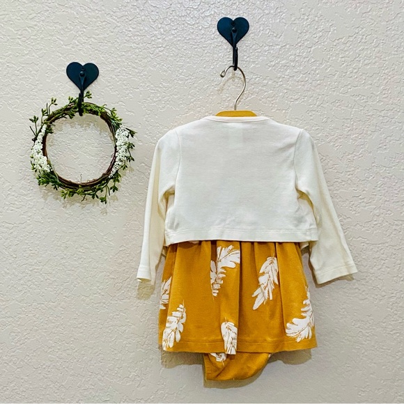 This is a mustard yellow dress and a cream colored cardigan - Picture 3 of 8